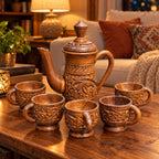 Handcrafted wooden jug with matching carved cups