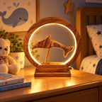 Wooden dolphin table lamp displayed as coastal home decor