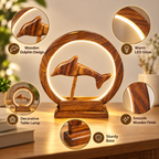 Carved wooden dolphin lamp with illuminated circular frame